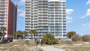A multi-story hotel with balconies, a pool area, and a beach view. - TOP Floor 2bd/2ba Oceanfront Master w Free Wi-fi (Myrtle Beach)