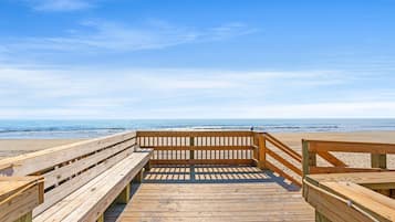 On the beach, sun-loungers, beach umbrellas, beach volleyball