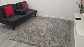 A modern living room with a black sofa, a grey carpet, and a white wall. - 3 mins to Henday ,16 mins to WEM
1 cozy bedroom in a quite neighborhood.
No Pets (Edmonton)
