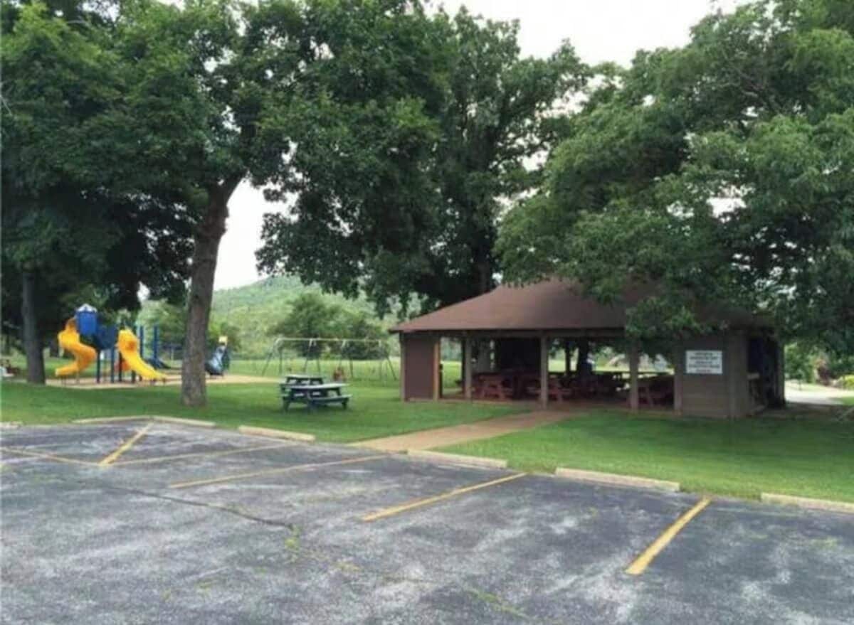 A park with a pavilion, picnic tables, and a playground.