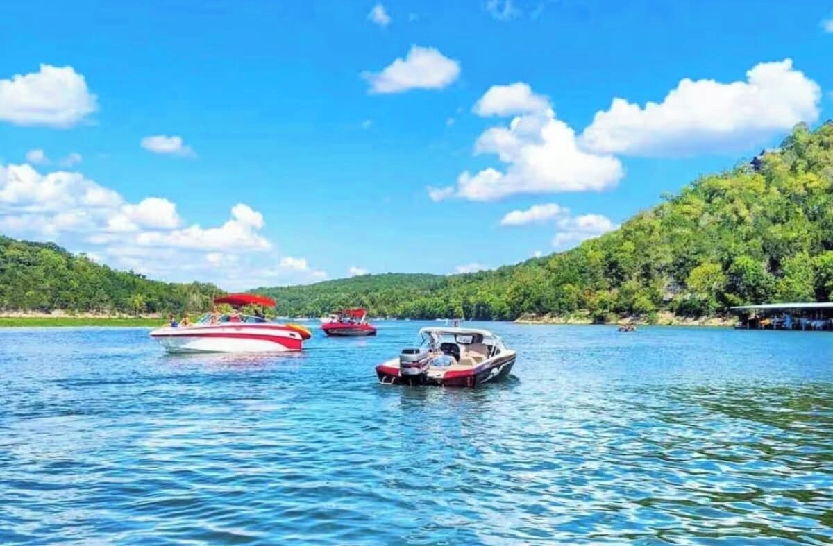 A lake with boats and a dock.
