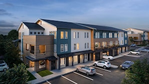 A multi-story residential building with a parking lot. - Landing | Incredible 1BD, Clubhouse (Austin)