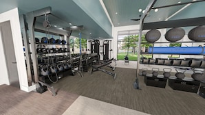 A gym with weightlifting equipment, kettlebells, and dumbbells. - Landing | Incredible 1BD, Clubhouse (Austin)