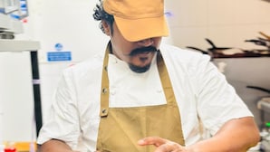 A person in a chef's uniform preparing food in a kitchen. - Belvilla at Brackley, near Silverstone Circuit (Brackley)