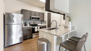 Fridge, dining tables - Landing | Stylish 1BD, Gym (McKinney)