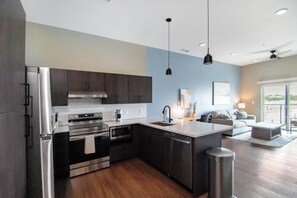 Fridge, dining tables - Landing | Stylish 1BD, Pool, Rooftop Lounge (Springfield)