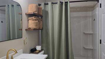 Shower, towels, soap, toilet paper