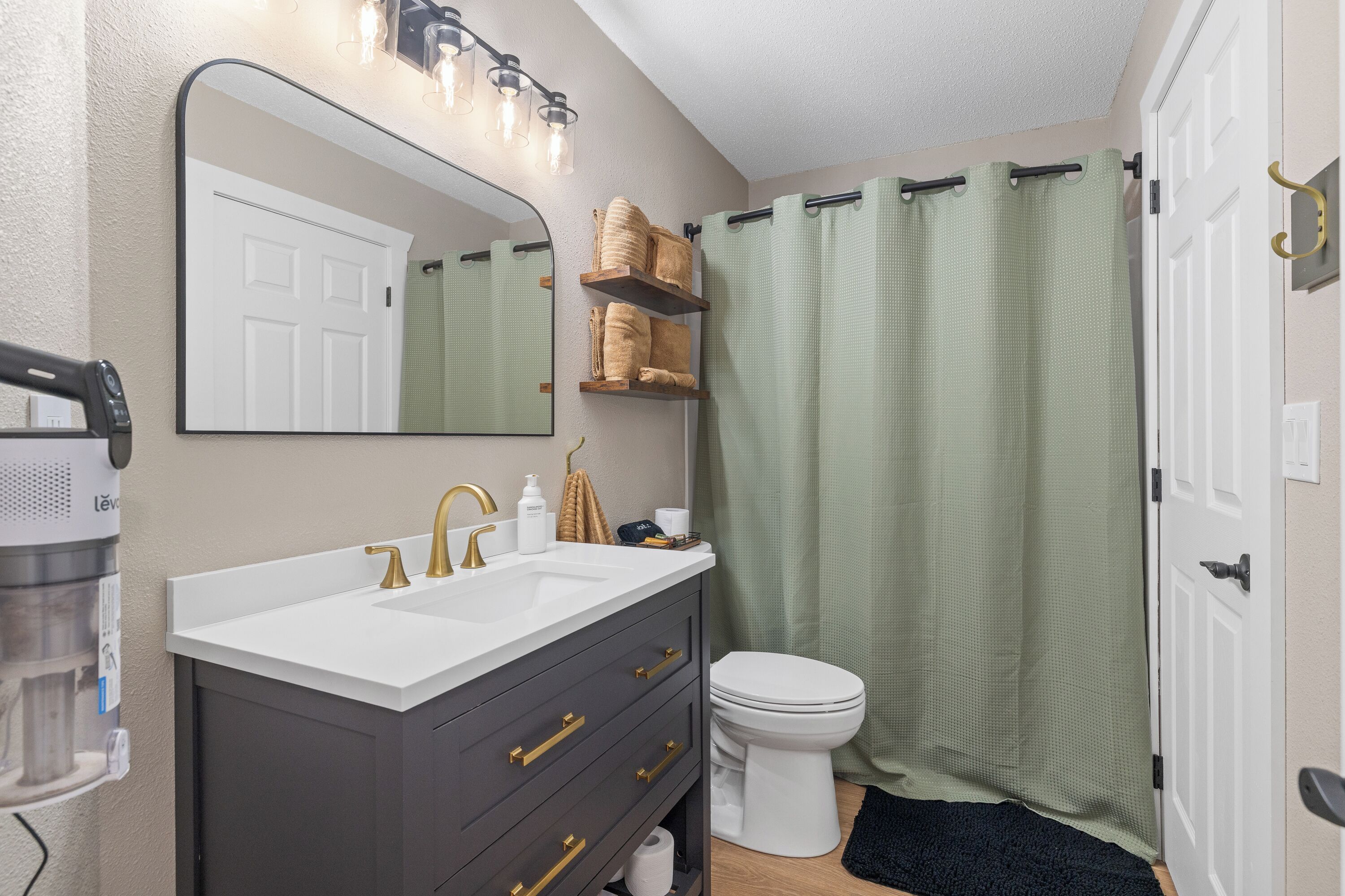 Shower, towels, soap, toilet paper