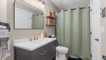 Shower, towels, soap, toilet paper