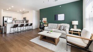 A modern apartment with a kitchen, dining area, and living room. - Landing | Amazing 3BD, Clubhouse, Gym (Celina)