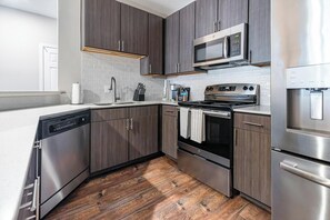 Fridge, dining tables - Landing | Stylish 2BD, Pool, Gym (Biloxi)