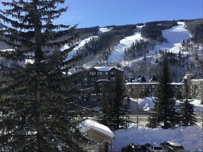 A lodge with multiple buildings, surrounded by snow-covered terrain and trees. - Sun Vail 22b, 2BD Condo With Vail Mountain Views (Vail)