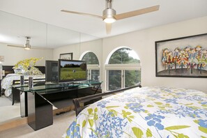 A bedroom with a bed, a desk, a television, and a ceiling fan. - Tyrolean 5, 3BD Condo in Vail Village (Vail)