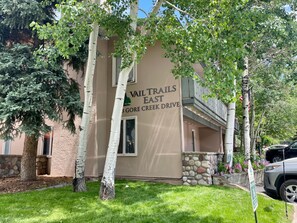 A building with a sign reading 'Vail Trails East 3 Gore Creek Drive.' - Vail Trails East 5B, 1BD Condo on East Side of Vail Village (Vail)