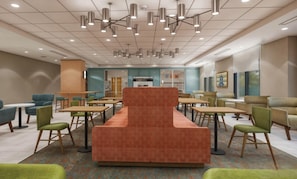 A modern lounge area with a central seating area, multiple tables, and overhead lighting.
