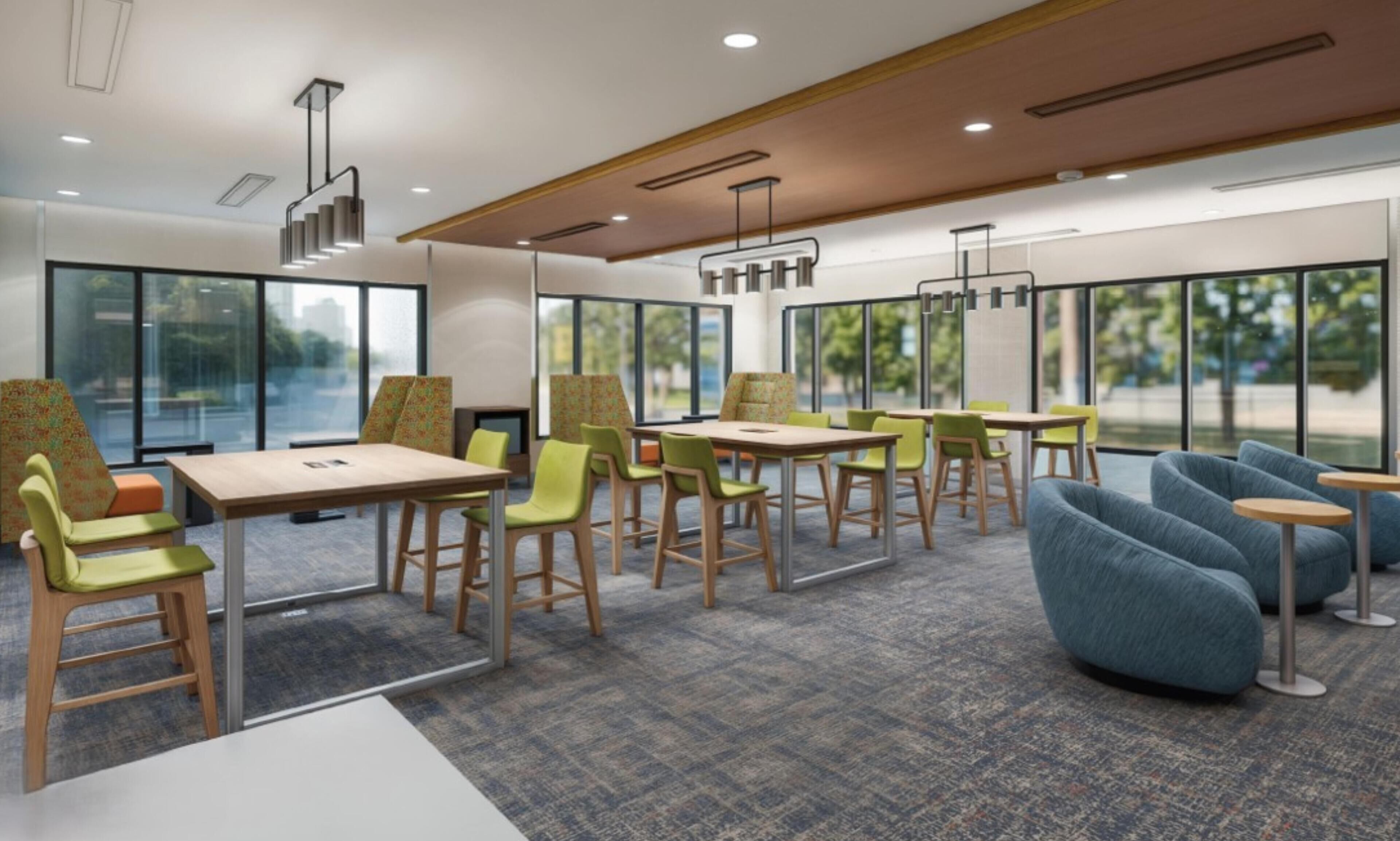 A modern meeting room with tables, chairs, and a large window.