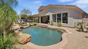 A house with a swimming pool, patio furniture, and a desert landscape. - Greyhawk Golf Escape w/ 5-Bedrooms, Heated Pool, Spa & Putting Green (Scottsdale)