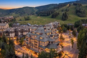 A resort with multiple buildings, roads, and a hilly landscape in the background. - Luxury Ski condo W/Resort Amenities | Walk to lift (Beaver Creek)