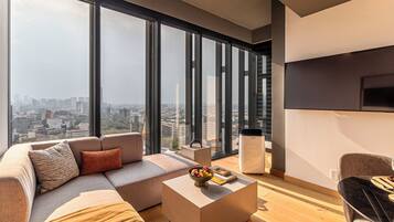 Deluxe Suite, City View | Living area | 55-inch Smart TV with digital channels