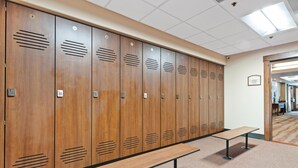 A row of wooden lockers with a bench in front, a tiled ceiling, and a carpeted floor. - Borders Lodge L108 2BD Beaver Creek Ski-in, Ski-out Condo (Avon)
