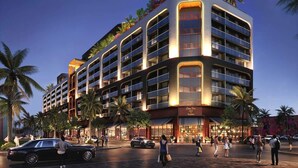 A multi-story hotel with balconies, a central entrance, and palm trees. - Luxury Wynwood 1BR with Rooftop Pool & Gym (Miami)