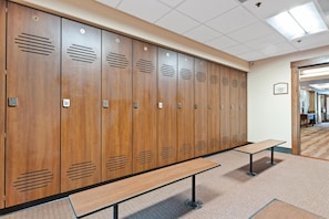A row of wooden lockers with a bench in front, a tiled ceiling, and a carpeted floor. - Borders Lodge L303 2BD Beaver Creek Ski-in, Ski-out Condo (Avon)