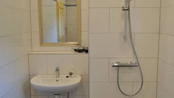 Shower, hair dryer, towels, toilet paper