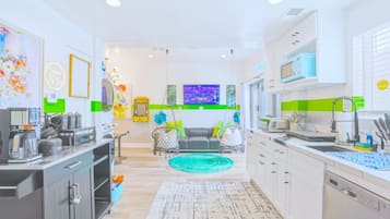 Microwave, coffee/tea maker, dining tables