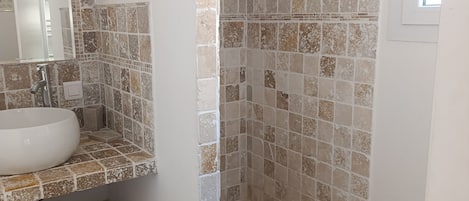 Shower, hair dryer, towels, toilet paper