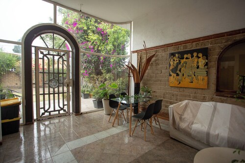House with garden in front of the Pyramid of Cholula, Puebla,MX
