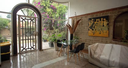 House with garden in front of the Pyramid of Cholula, Puebla,MX