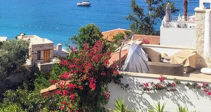 EV In the Heart of Kalkan: Cozy House with Sea View Terrace, 3-Min Walk to Beach