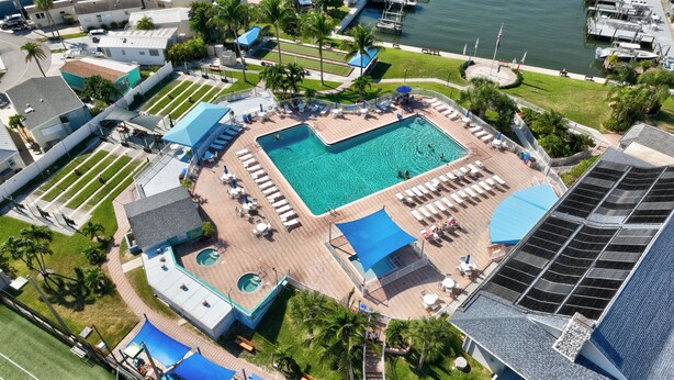 A resort with a large central pool, multiple smaller pools, and a marina. - Beachbound 2BR Apt 1282 (Jensen Beach)