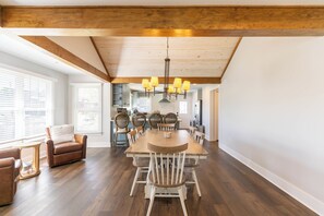 A dining area with a wooden table, chairs, and a chandelier. - Stella Maris - own Blowing Rock Pet Friendly Updated Craftsman Bungalow (Blowing Rock)