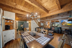 A wooden interior with a dining area, a coffee bar, and a living room with a sofa and TV. - 5 Bears Cabin Wooded Cabin With hot Tub, Arcade Games, Pool Table, Fire pit (Banner Elk)