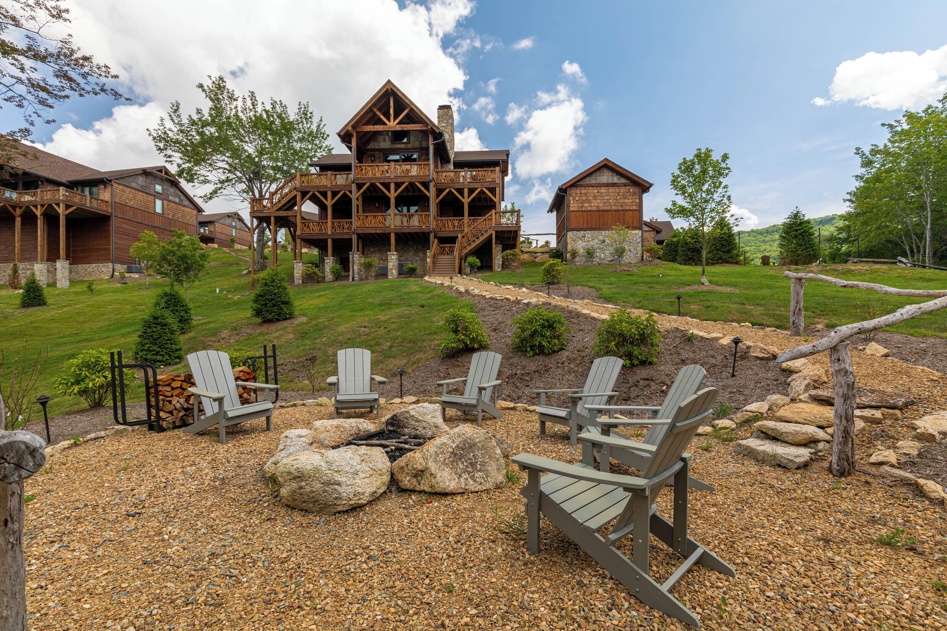 A lodge with a large wooden structure, outdoor seating, and a well-maintained garden.