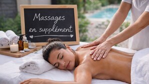 A massage therapy session with a sign reading 'Massages en supplément' in a spa setting. - Loft "The Jungle (Châteaurenard)