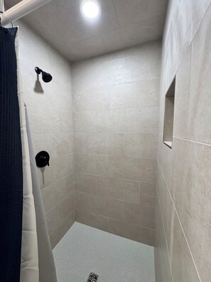 Shower, towels, soap, toilet paper