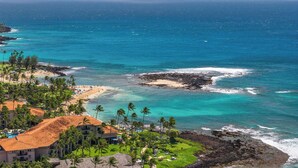 A coastal hotel with a view of the ocean, beach, and palm trees. - Kiahuna 183 AC, Ground Floor Ocean View PBAC (Koloa)