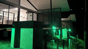 A modern building with large windows and a flat roof. - Lake view Cattle Ranch Villa (Río Chiquito)