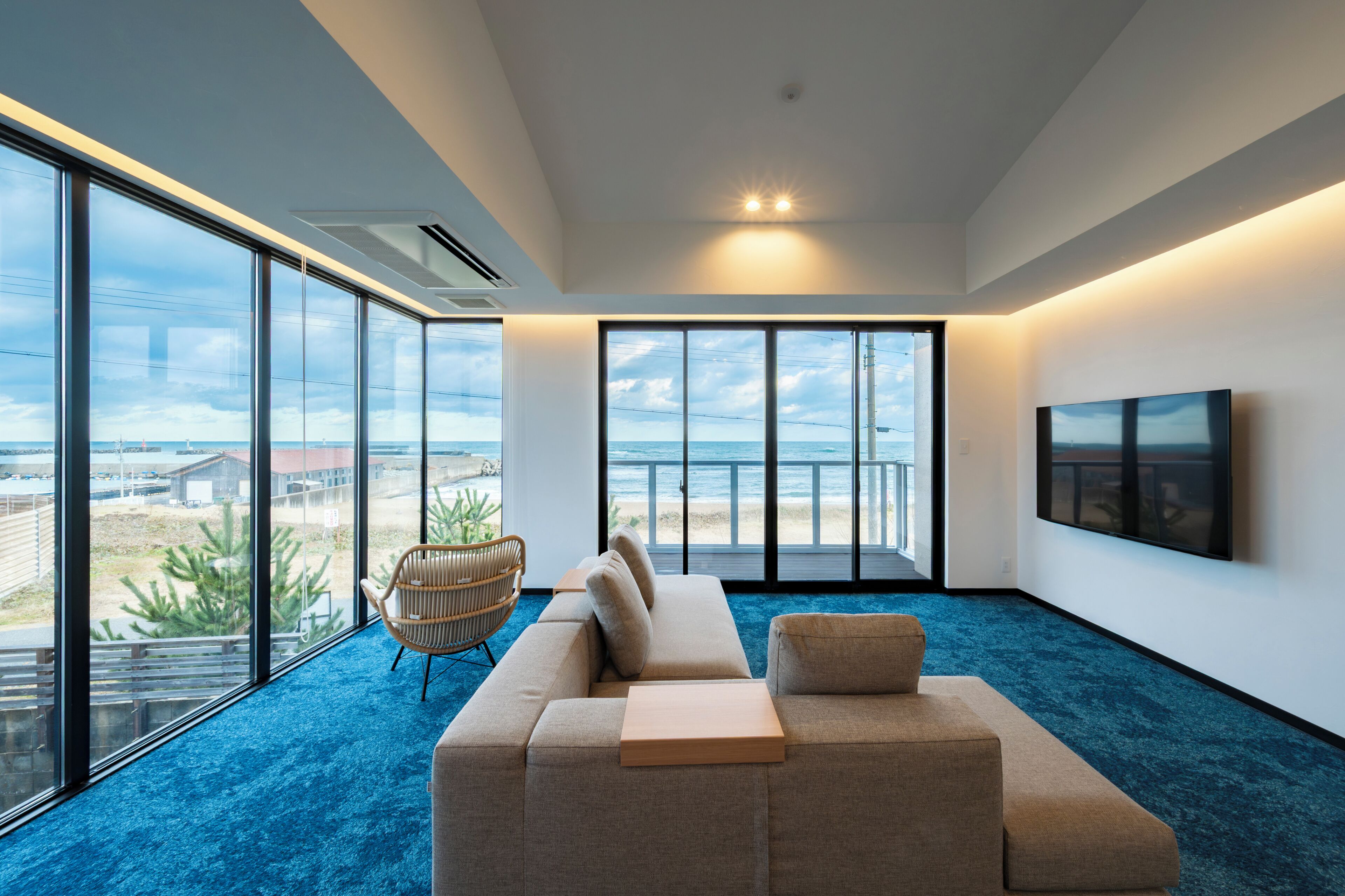 Suíte panorâmica, sacada, vista para o oceano | Área de estar