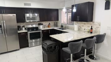Coffee/tea maker, fridge, microwave, oven
