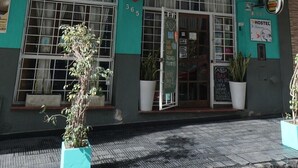 A hostel with a sign reading 'Mediterranean Hostel' and a 'Hostel' sign above the entrance. - Mediterranea Hostel (Córdoba)