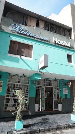 A hostel with a sign reading 'Mediterranean Hostel' and a 'Hostel' sign above the entrance. - Mediterranea Hostel (Córdoba)