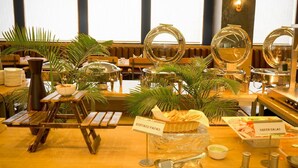 A buffet setup with labeled food items like rostaed papad and green salad. - Pinnacle Grand Hotel Nad Banquet (Ahmedabad)