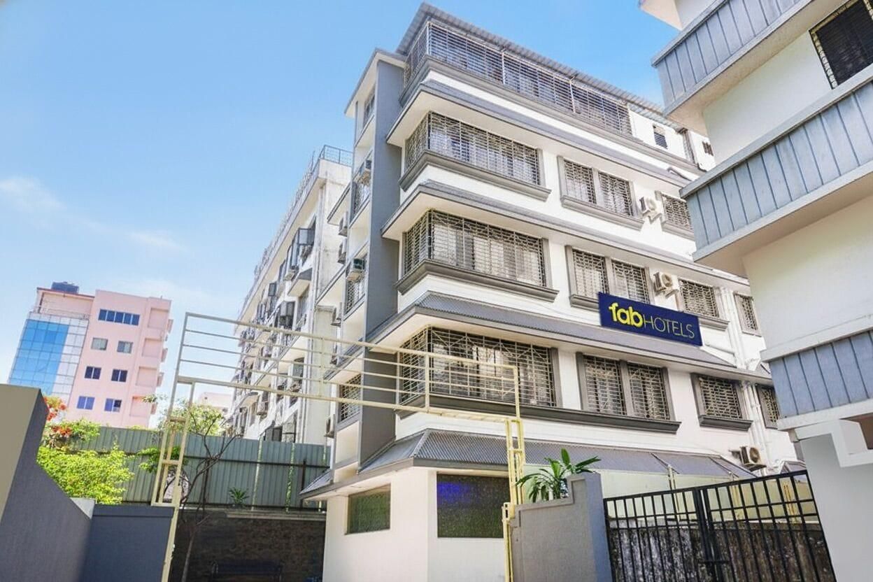 A multi-story building with a sign for 'Tab Hotels' indicating a hotel presence.