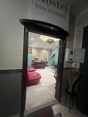 A hostel entrance with a sign reading 'Hostel View Pyramids.'