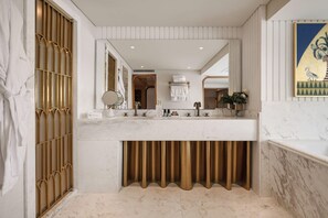 A bathroom with a marble vanity, a large mirror, and a gold curtain. - Soleil Nile Cruise (Cairo)