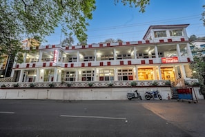 A multi-story hotel with a prominent sign for 'Hotel India.' - India Hotel (Nainital)