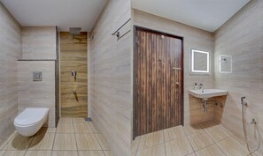 A bathroom with a toilet, shower, and sink. - Treebo Vetri Supreme Residency (Chennai)